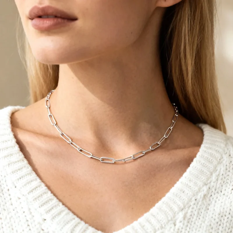 Sterling silver paperclip chain necklace showcased on woman